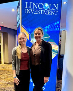Two Southwest FL Financial Planners Posing in an Event